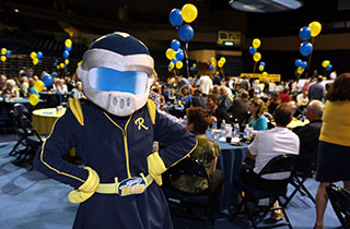 Photo of Rocksy the Rocket attending the Spring Raffle.